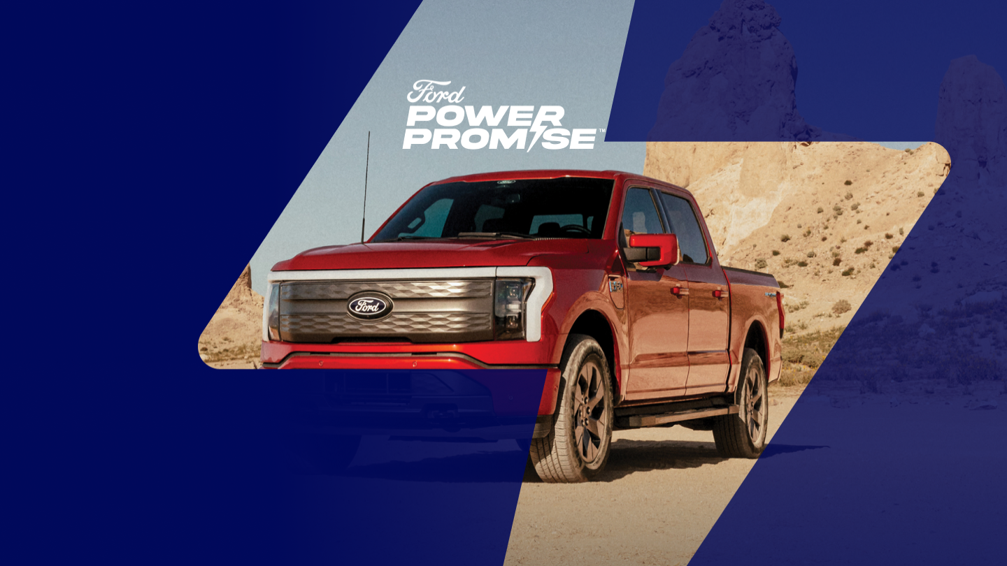 A red F-150 Lightning® truck sitting on a dirt road.